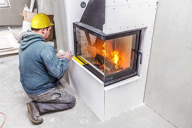 Technician Performing Fireplace Chimney Repair in Warwick RI