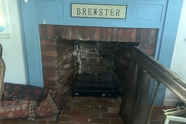 Brick Fireplace Needing Chimney Inspection in Warwick, RI Living Room