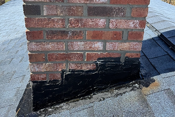 Brick Chimney Repaired on a Roof in Warwick RI
